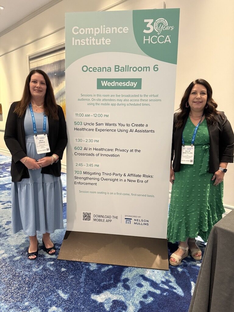 Micki Jernigan at HCCA Compliance Institute 2026, standing beside the Wednesday session banner listing 'AI in Healthcare: Privacy at the Crossroads of Innovation' (session 602, Oceana Ballroom 6)